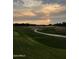 Scenic golf course view at sunset with manicured greens and a winding path at 11633 N 40Th Way, Phoenix, AZ 85028