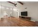 Spacious living room featuring a vaulted ceiling, wood beam accents, and hardwood floors throughout at 11633 N 40Th Way, Phoenix, AZ 85028