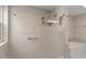 Modern shower showcasing large tiles, glass door, shower head and grab bar at 11633 N 40Th Way, Phoenix, AZ 85028