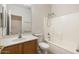 Clean bathroom features a shower-tub combination, toilet, and single sink vanity with ample lighting at 11702 W Lincoln St, Avondale, AZ 85323