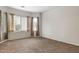 Bright bedroom with large windows offering plenty of natural light and neutral carpeting throughout at 11702 W Lincoln St, Avondale, AZ 85323