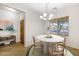 Dining room featuring a modern light fixture, and a large window with natural light at 11702 W Lincoln St, Avondale, AZ 85323