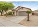 Well maintained home with neutral color palette, two car garage, and drought tolerant landscaping at 11702 W Lincoln St, Avondale, AZ 85323