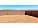 Large backyard area with block wall fence and potential for landscaping at 11948 E Aster Ln, Florence, AZ 85132