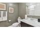 Neutral-toned bathroom features a marble countertop and a toilet with leafy green plant on the tank at 11948 E Aster Ln, Florence, AZ 85132