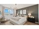 Inviting bedroom featuring a plush bed, stylish decor, and lots of natural light at 11948 E Aster Ln, Florence, AZ 85132