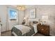 Charming bedroom with a whimsical accent wall, plush bed, and modern nightstands at 11948 E Aster Ln, Florence, AZ 85132