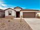 Charming single-story home with a two-car garage and low maintenance landscaping at 11948 E Aster Ln, Florence, AZ 85132
