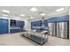 Commercial kitchen features stainless steel appliances, blue cabinets, and a large island counter at 11948 E Aster Ln, Florence, AZ 85132