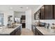 Modern kitchen with stainless steel appliances and marble countertops at 11948 E Aster Ln, Florence, AZ 85132