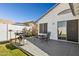 Backyard features a grill, patio furniture and plants on a deck outside the house at 13320 N 82Nd Dr, Peoria, AZ 85381