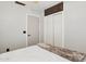 Bright bedroom featuring a white closet door and neutral walls, creating a serene atmosphere at 13320 N 82Nd Dr, Peoria, AZ 85381