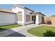 Charming home with stucco exterior, desert landscaping, and welcoming entrance at 13320 N 82Nd Dr, Peoria, AZ 85381