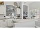 Spacious kitchen featuring countertops, sink, and an open archway leading to the living room at 13320 N 82Nd Dr, Peoria, AZ 85381