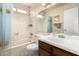 Bathroom with a combined tub and shower, smiley face decor, and a vanity at 1409 S Revere --, Mesa, AZ 85210