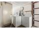 Laundry room featuring side by side washer and dryer units, with a water heater at 1409 S Revere --, Mesa, AZ 85210