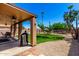 Well maintained backyard with covered patio and desert landscaping at 15427 W Port Au Prince Ln, Surprise, AZ 85379