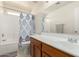 Bright bathroom featuring tub/shower, sink with vanity, and ample lighting at 15427 W Port Au Prince Ln, Surprise, AZ 85379