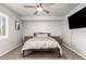 Relaxing bedroom featuring a gray color palette, natural light, and plush carpet at 15427 W Port Au Prince Ln, Surprise, AZ 85379