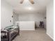 Loft space with sitting area, gray walls, carpeted floors, and natural light at 15427 W Port Au Prince Ln, Surprise, AZ 85379