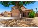 Charming two-story home featuring a well-maintained front yard and an attached two-car garage at 15427 W Port Au Prince Ln, Surprise, AZ 85379
