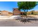 Charming two-story home with a two-car garage and neatly maintained landscaping at 15427 W Port Au Prince Ln, Surprise, AZ 85379