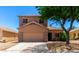 Charming two-story home featuring a neutral color scheme, well-maintained landscaping, and a two-car garage in a sunny neighborhood at 15427 W Port Au Prince Ln, Surprise, AZ 85379