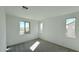 Light-filled bedroom with neutral carpet and bright, natural light from multiple windows at 15634 W Hackamore Dr, Surprise, AZ 85387