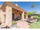 Inviting outdoor space with a shaded patio and lush landscaping for relaxation at 17342 E Quail Ridge Dr, Fountain Hills, AZ 85268