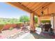 Outdoor seating area with ceiling fan with a charming garden view at 17342 E Quail Ridge Dr, Fountain Hills, AZ 85268