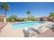 Community pool and lounge area with seating offering desert views and a clear blue pool under a sunny sky at 17342 E Quail Ridge Dr, Fountain Hills, AZ 85268