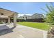 Backyard featuring an artificial turf area, a covered patio, and privacy wall at 1839 E Parkside Ln, Phoenix, AZ 85024
