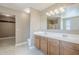 Bathroom features dual sinks, spacious countertops, and a large mirror at 1839 E Parkside Ln, Phoenix, AZ 85024