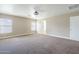 Expansive bedroom with carpet, large windows, and a ceiling fan for added comfort at 1839 E Parkside Ln, Phoenix, AZ 85024