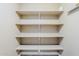 Bright closet features multiple shelves for optimal storage and organization, perfect for any homeowner at 1839 E Parkside Ln, Phoenix, AZ 85024