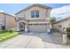 Charming two-story home features a two-car garage and manicured lawn with desert landscaping at 1839 E Parkside Ln, Phoenix, AZ 85024