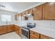 Bright kitchen with stainless steel appliances, stylish counters, and ample cabinet storage at 1839 E Parkside Ln, Phoenix, AZ 85024