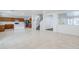 Open-concept living space with tile flooring, staircase, and views into the kitchen at 1839 E Parkside Ln, Phoenix, AZ 85024