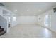 Large, airy living space with tiled floors that connect to the stairs and front door at 1839 E Parkside Ln, Phoenix, AZ 85024