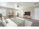 Spacious main bedroom with carpet, modern furnishings, and natural light from several windows at 1839 E Parkside Ln, Phoenix, AZ 85024