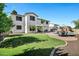 Lush backyard featuring a pool, patio furniture, and well-maintained lawn at 18429 W Mauna Loa Ln, Surprise, AZ 85388