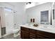 Clean bathroom with a shower-tub combo and a double sink vanity at 18429 W Mauna Loa Ln, Surprise, AZ 85388