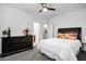 Bright bedroom with a dark wood dresser and plush carpeting at 18429 W Mauna Loa Ln, Surprise, AZ 85388