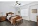 Cozy bedroom showcasing a decorative wooden bed frame and soft, neutral color palette at 18429 W Mauna Loa Ln, Surprise, AZ 85388