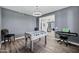 Inviting game room with a foosball table, piano, and a view into the foyer at 18429 W Mauna Loa Ln, Surprise, AZ 85388