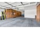 Spacious garage featuring ample cabinet storage space and an automatic door at 18429 W Mauna Loa Ln, Surprise, AZ 85388