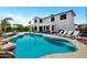 Spacious backyard with a large pool, lounge chairs, and ample patio space at 18429 W Mauna Loa Ln, Surprise, AZ 85388