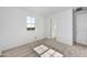 Bright bedroom featuring plush carpet, a window with natural light, and a closet at 18950 W Stella Ave, Waddell, AZ 85355
