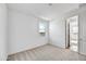 Bright bedroom featuring plush carpet, a window with natural light, and a closet at 18950 W Stella Ave, Waddell, AZ 85355