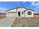 Charming single-story home with a two-car garage and low maintenance desert landscaping at 18950 W Stella Ave, Waddell, AZ 85355